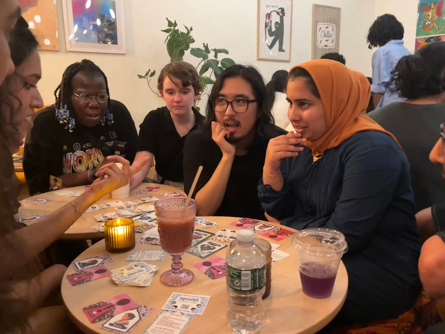 A second table at Fontainhaus mid-game, drinks and gossip cards everywhere